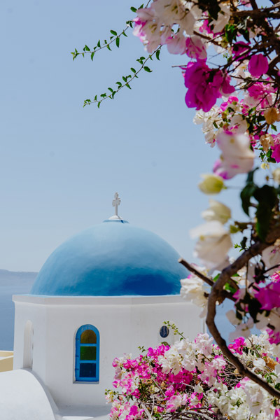 Greece, looking at a domed building and flowers