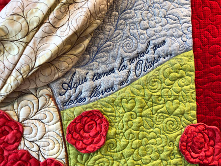 detail of a miracle with roses quilt
