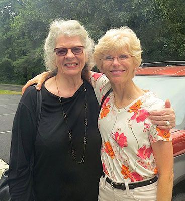 Janet Taylor with Linda Neel in parking lot at Penland School of Craft