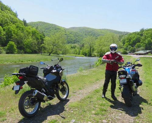 Two motorcycles in scenic setting