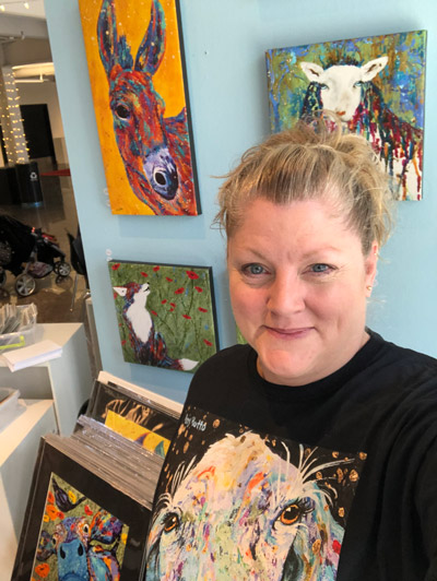 Amy Hutto with paintings