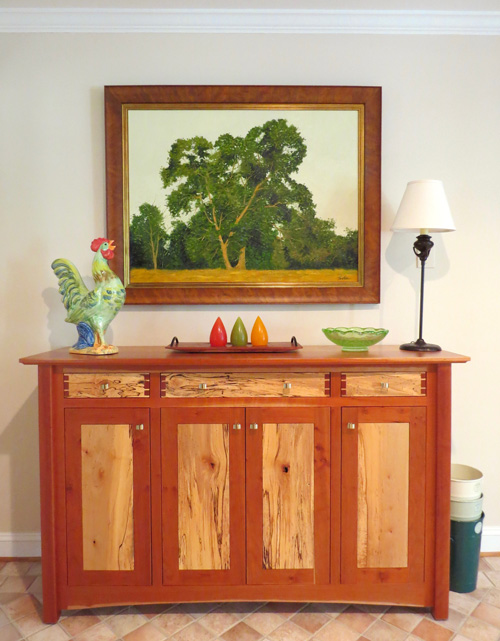 Decorating with art like Big Fella by Tom Neel shows a love of nature, trees, or family.